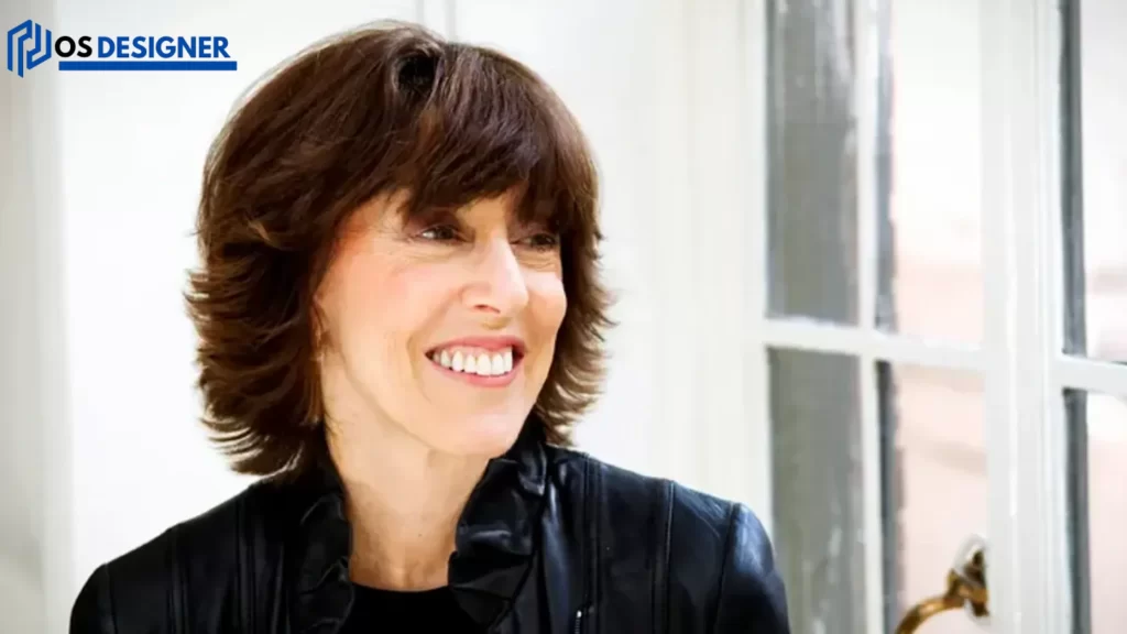 "Smiling, Nora Ephron embodies her belief that 'You can never have too much,' a reflection of her vibrant spirit and creative energy."